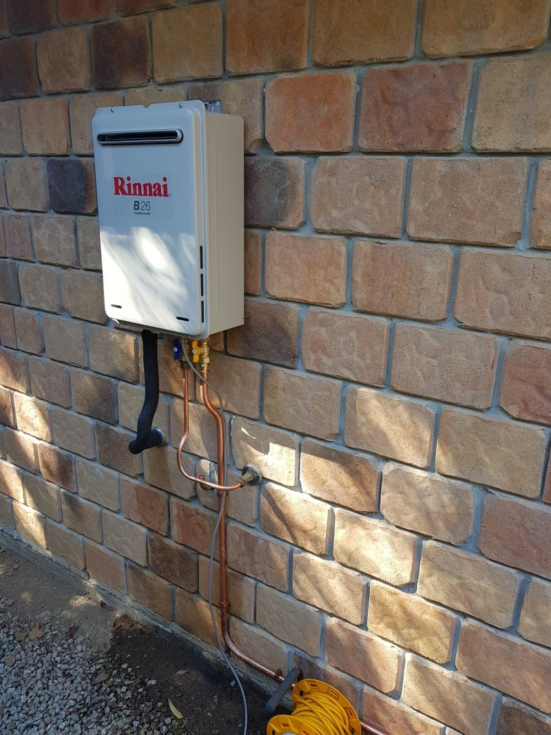 Rinnai B26 installed on a brick wall | Featured image for Rinnai B16 (REU-A1624WB) + Installation Kit - 50 Degree Preset LPG.